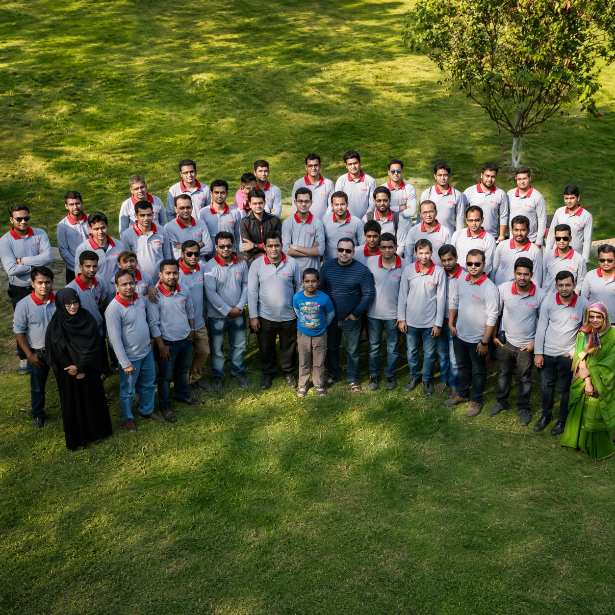 Inpace team gathered outdoors for an anniversary group portrait.