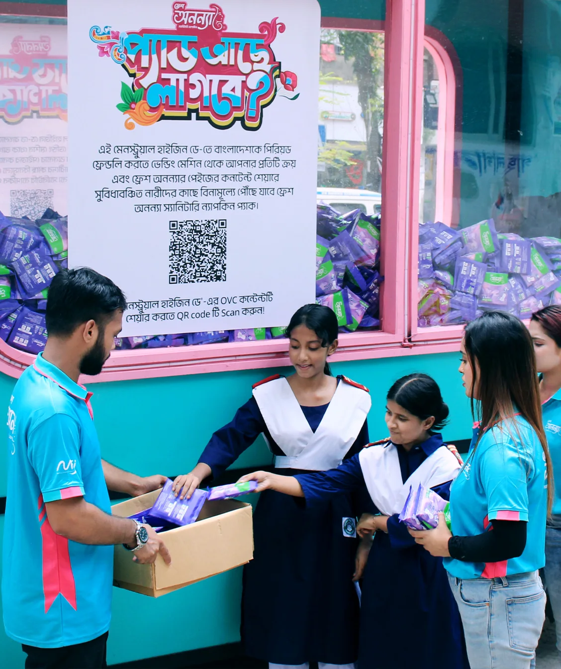 Fresh Anonna caravan team distributing products to visitors.